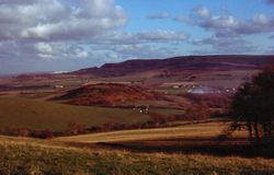 Slippages of the southern Downs (on the horizon) overlooking the valley of the Eastern Yar 